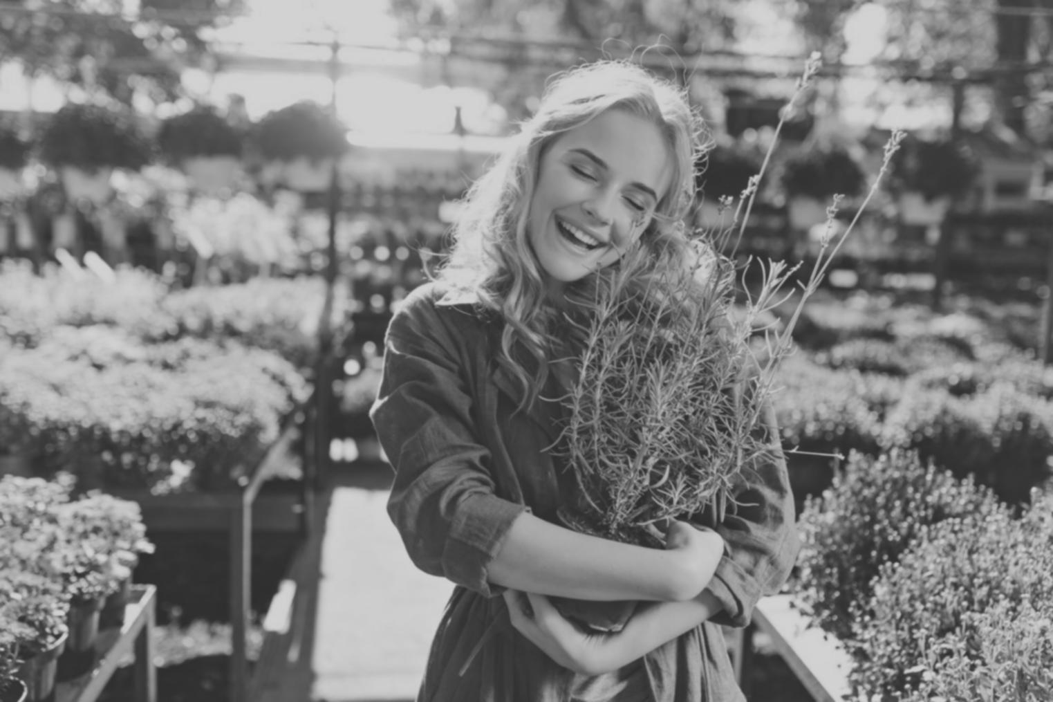 Student arranging flowers in workshop setting